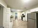 Bright kitchen with white cabinets, stainless steel appliances, and granite countertops at 4162 Mercer Rd, Decatur, GA 30035