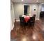 Cozy dining room featuring dark wood floors and a round table with seating for four at 3479 Thompson Nw Dr, Atlanta, GA 30331