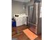 Practical laundry area with a modern washer, dryer, and stainless steel refrigerator at 3479 Thompson Nw Dr, Atlanta, GA 30331