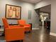 Inviting living room featuring hardwood floors, gray walls, and cozy orange armchairs at 3479 Thompson Nw Dr, Atlanta, GA 30331