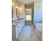 Bright bathroom with double vanity, soaking tub, walk-in shower, and large windows at 1685 Crumbley Rd # 4, Mcdonough, GA 30252