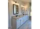 Bathroom with double vanity, gray granite, black hardware, and large windows at 1685 Crumbley Rd # 4, Mcdonough, GA 30252