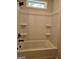 Clean bathroom with a white tub-shower combination and black hardware at 1685 Crumbley Rd # 4, Mcdonough, GA 30252