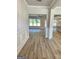 Inviting entryway featuring light wood floors, decorative molding and bright, neutral paint at 1685 Crumbley Rd # 4, Mcdonough, GA 30252