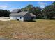 Two-story home boasts an attached garage and neutral blue siding, situated on a spacious lot at 1685 Crumbley Rd # 4, Mcdonough, GA 30252