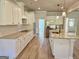 Elegant kitchen with granite countertops, stainless appliances, and light wood flooring at 1685 Crumbley Rd # 4, Mcdonough, GA 30252