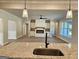 Open concept living space with fireplace and bar seating from the kitchen island at 1685 Crumbley Rd # 4, Mcdonough, GA 30252