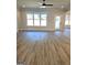 Sun-drenched living room boasting wood floors and a door to the outdoors at 1685 Crumbley Rd # 4, Mcdonough, GA 30252