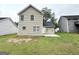 Backyard with vinyl siding house, lawn, and back patio offers outdoor living at 9151 Jefferson Village Sw Dr, Covington, GA 30014