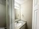 Clean bathroom featuring granite countertops, a sink, and a mirror at 9151 Jefferson Village Sw Dr, Covington, GA 30014