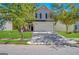 Charming two-story home featuring a well-maintained lawn and a two-car garage at 9151 Jefferson Village Sw Dr, Covington, GA 30014