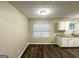 Eat-in kitchen with white cabinetry, granite countertops, and modern appliances at 9151 Jefferson Village Sw Dr, Covington, GA 30014