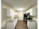 Well-equipped kitchen with stainless steel appliances, white cabinets, and granite countertops at 9151 Jefferson Village Sw Dr, Covington, GA 30014