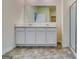 Bright bathroom features white cabinets, a mirror, a walk-in shower, and tile flooring at 616 Whitman Ln # 30, Stockbridge, GA 30281
