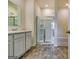 Bathroom featuring white cabinets, a walk-in shower, and a tub, and tile flooring at 616 Whitman Ln # 30, Stockbridge, GA 30281