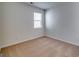 The bedroom features carpet flooring, bright white walls, and a window with coverings at 616 Whitman Ln # 30, Stockbridge, GA 30281