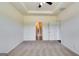Spacious bedroom featuring neutral carpet, ceiling fan, and an open doorway to the bathroom at 616 Whitman Ln # 30, Stockbridge, GA 30281