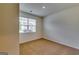 Bright bedroom with neutral carpet, a window with blinds, and fresh paint at 616 Whitman Ln # 30, Stockbridge, GA 30281