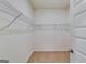 Walk-in closet with wire shelving and tan carpeted floor seen through the open door at 616 Whitman Ln # 30, Stockbridge, GA 30281