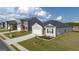 New construction home exterior showing the garage, driveway, and front yard at 616 Whitman Ln # 30, Stockbridge, GA 30281