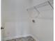 Laundry room featuring tile flooring and a wire rack above the washer and dryer hookups at 616 Whitman Ln # 30, Stockbridge, GA 30281