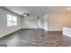 Bright living room featuring hardwood flooring, a ceiling fan, and an open entryway at 616 Whitman Ln # 30, Stockbridge, GA 30281