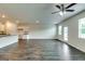 Open-concept living room featuring hardwood floors, recessed lighting, and an eat-in kitchen at 616 Whitman Ln # 30, Stockbridge, GA 30281