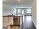 Open-concept living space with granite counters and stainless steel appliances at 616 Whitman Ln # 30, Stockbridge, GA 30281