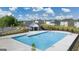 Aerial view of community pool area with pool house and landscaping at 616 Whitman Ln # 30, Stockbridge, GA 30281