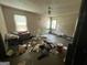 Spacious bedroom with a ceiling fan and two windows, showing potential for renovation and personal touches at 530 Whitley Dr, Forest Park, GA 30297