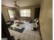 Bright living room featuring checkered floors, a rocking chair, and an open doorway to the exterior at 530 Whitley Dr, Forest Park, GA 30297