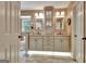 The primary bathroom offers dual vanities, modern lighting, and updated fixtures at 104 Whisper Trce, Peachtree City, GA 30269
