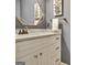 Modern bathroom features a marble countertop, stylish mirror, and brushed bronze fixtures at 104 Whisper Trce, Peachtree City, GA 30269