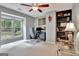 Comfortable bedroom with neutral walls, large window, and updated ceiling fan at 104 Whisper Trce, Peachtree City, GA 30269