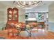 Elegant dining room with modern chandelier, wood table, and view into the bright, updated kitchen at 104 Whisper Trce, Peachtree City, GA 30269