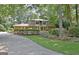 Traditional two-story home featuring brick facade, lush landscaping, and a curved driveway at 104 Whisper Trce, Peachtree City, GA 30269
