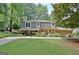 Charming two-story home with a well-manicured front yard, lush landscaping, and a welcoming curb appeal at 104 Whisper Trce, Peachtree City, GA 30269