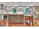 Renovated kitchen featuring pendant lighting, an island with seating, and stainless steel appliances at 104 Whisper Trce, Peachtree City, GA 30269
