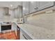 Kitchen showcasing white countertop, stainless steel appliances, and white cabinets at 104 Whisper Trce, Peachtree City, GA 30269