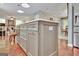 The kitchen island has multiple drawers and pull-out shelves, plus beautiful floors at 104 Whisper Trce, Peachtree City, GA 30269