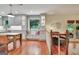 Open living space with window seating, dining area, and access to the kitchen at 104 Whisper Trce, Peachtree City, GA 30269