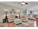 Comfortable living room showcases stylish furniture and decor with hardwood floors at 104 Whisper Trce, Peachtree City, GA 30269