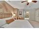 Cozy bedroom featuring a unique headboard, ceiling fan, and ensuite bathroom access at 104 Whisper Trce, Peachtree City, GA 30269