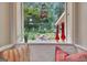 Window seat view overlooking backyard landscaping and greenery at 104 Whisper Trce, Peachtree City, GA 30269