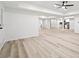 Open-concept basement featuring woodgrain floors, recessed lights, and a stylish kitchenette at 1007 Fairway Seven, Villa Rica, GA 30180