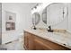 Bright bathroom with double sink vanity, granite countertop, and decorative mirrors at 1007 Fairway Seven, Villa Rica, GA 30180