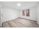 Bright bedroom featuring woodgrain floors, a window and ample natural light at 1007 Fairway Seven, Villa Rica, GA 30180
