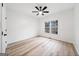 Bright bedroom featuring light wood-look floors and a modern ceiling fan at 1007 Fairway Seven, Villa Rica, GA 30180