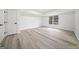 Well-lit bedroom featuring woodgrain floors, a window and a closet at 1007 Fairway Seven, Villa Rica, GA 30180