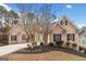 Traditional brick home boasts manicured landscaping and a well-maintained lawn at 1007 Fairway Seven, Villa Rica, GA 30180